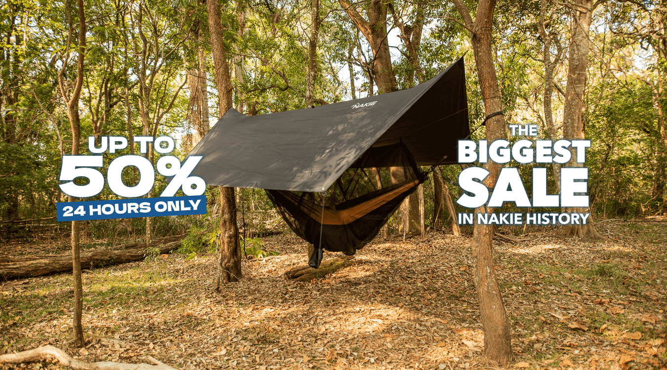 Man in Nakie Hammock camping ecosystem in the bush