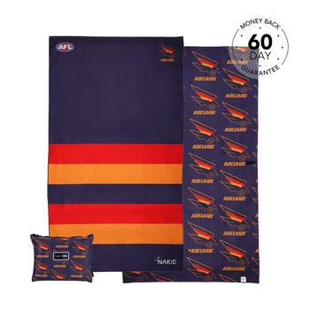 Adelaide Crows AFL beach towel with navy, red and gold horizontal stripes, displayed flat with matching patterned pillow and 