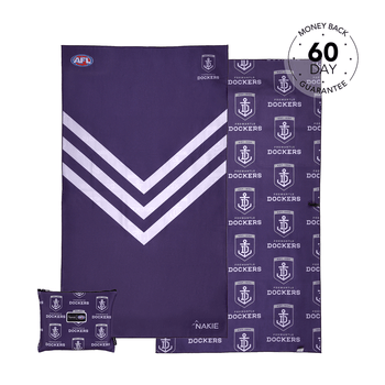 Purple Fremantle Dockers beach towel with white chevron stripe and anchor logo pattern, displayed flat with matching pillowca