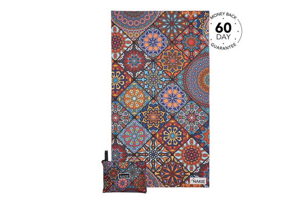 Multicolored geometric mandala patterned recycled beach towel with matching small pouch, displayed flat.