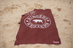 Burgundy beach towel with white Ringers Western logo and pig graphic, laid flat on sand preview #5