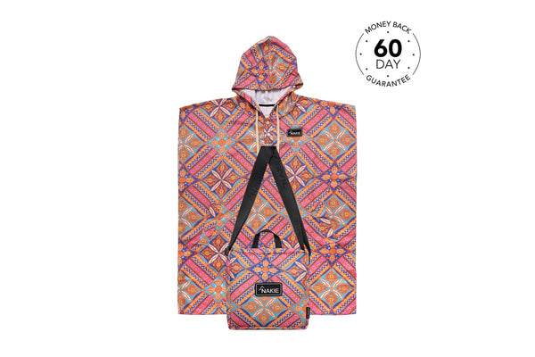 Multicolour geometric patterned hooded towel with pink, orange, and blue diamond designs and black straps visible.