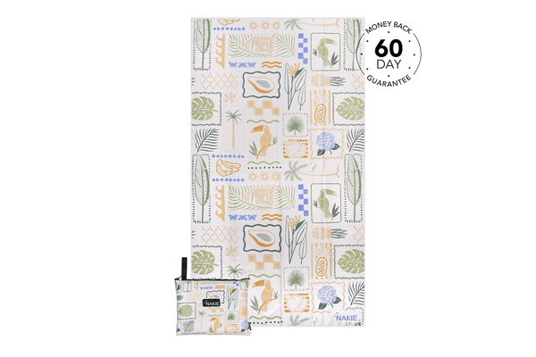 Recycled sand-free beach towel with botanical and tropical print in cream, green, blue and gold tones